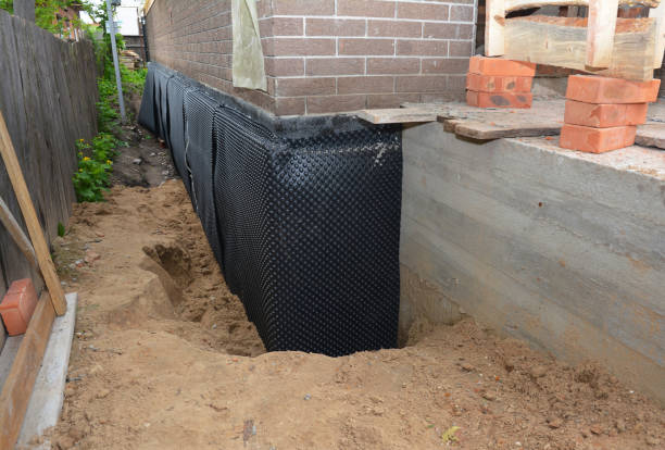 Happy homeowners after waterproofing job in Loachapoka